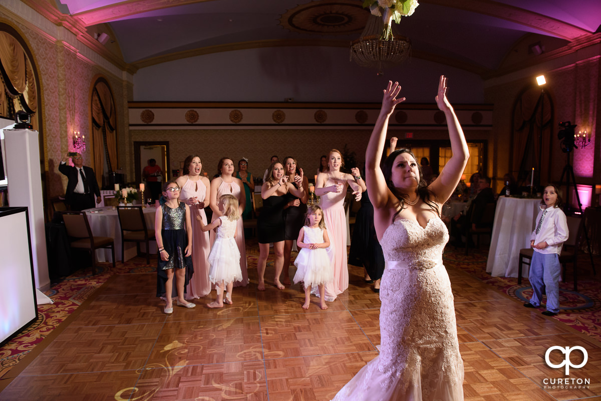 Bride tossing the bouquet.