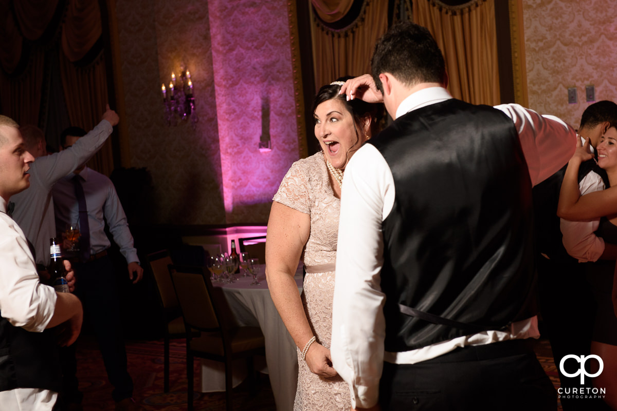 Grooms mother dancing.