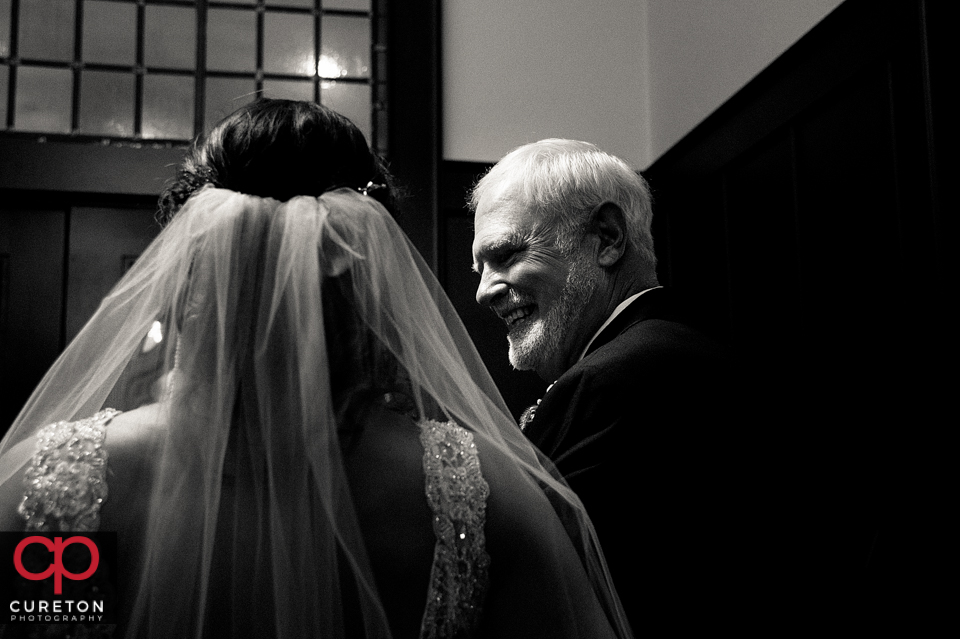Bride and her father sharing a moment before she walks down the aisle at St. Mary's in downtown Greenville.
