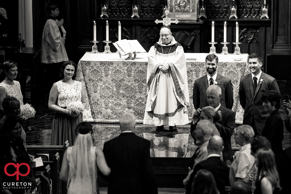 Groom sees bride for the first time as she walks down the aisle at St. Mary's.