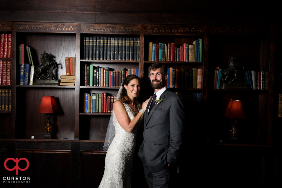 Bride and groom posing in the study.