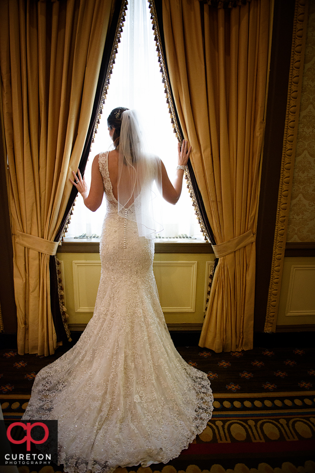 Brides standing in the window at the Westin Westin Poinsett.