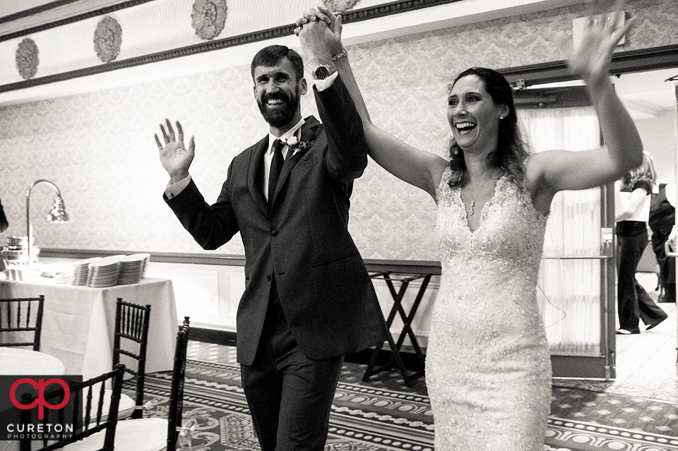 Bride and groom making their entrance into the reception.