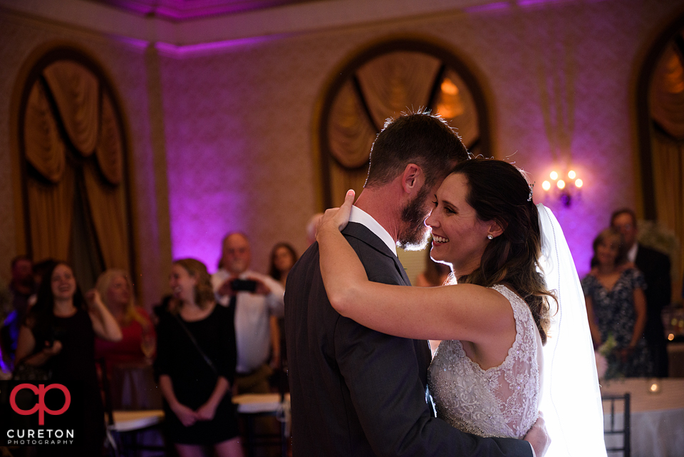 Bride and groom sharing a first dance.