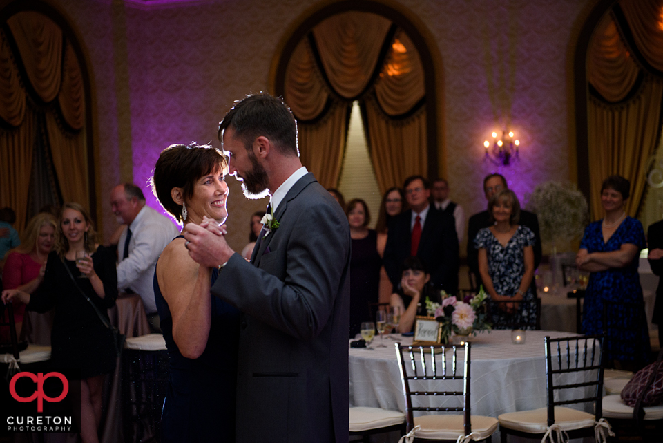 Groom dancing with his mom at the reception.