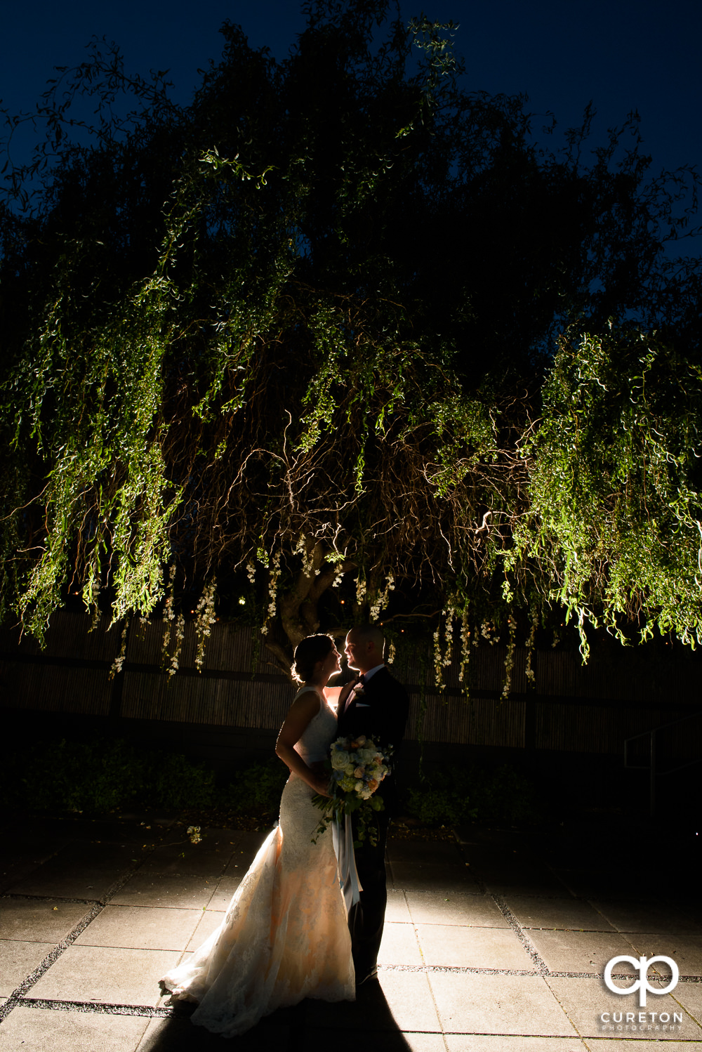 Bride and Groom outside at sunset during their wedding reception at Zen Greenville.