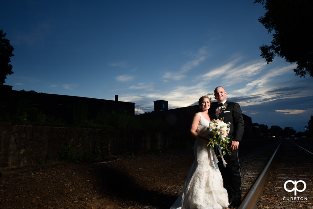 Bride and Groom at sunset in downtown Greenville.