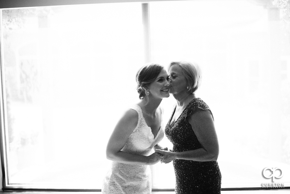Bride and her mother sharing a moment before the ceremony at Covenant United Methodist Church.