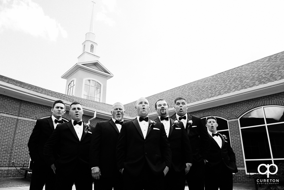Groom and groomsmen in the courtyard before the wedding ceremony.