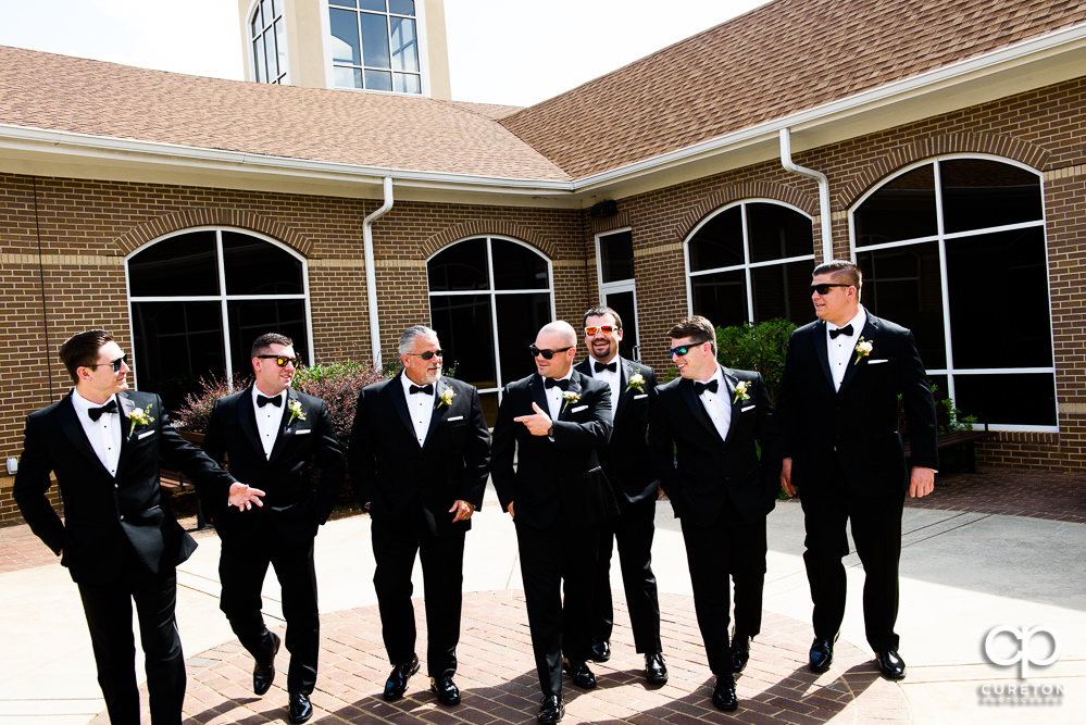 Groom and groomsmen in the courtyard before the wedding ceremony.
