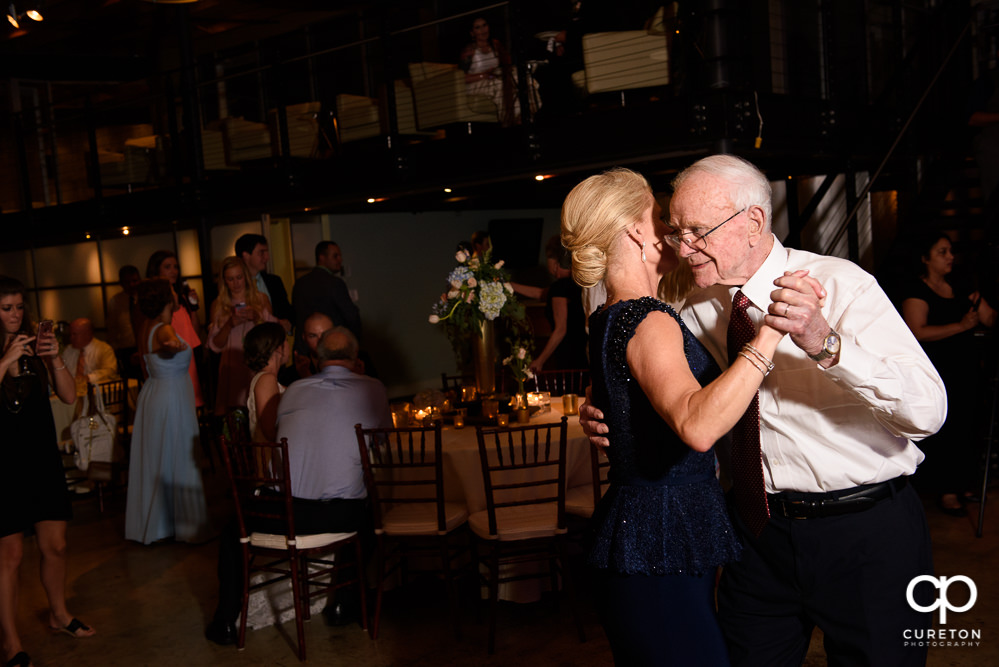 Groom's mother and grandfather dancing.