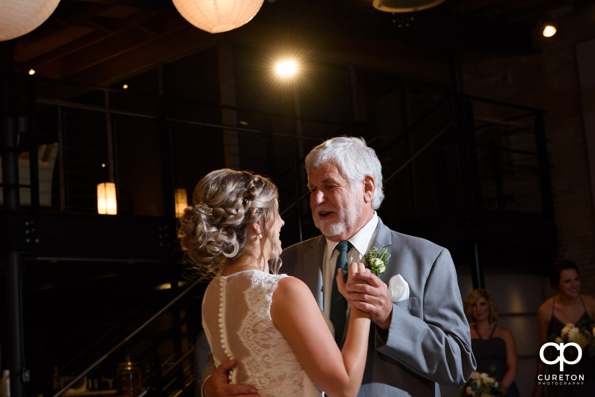 Bride dancing with her father.